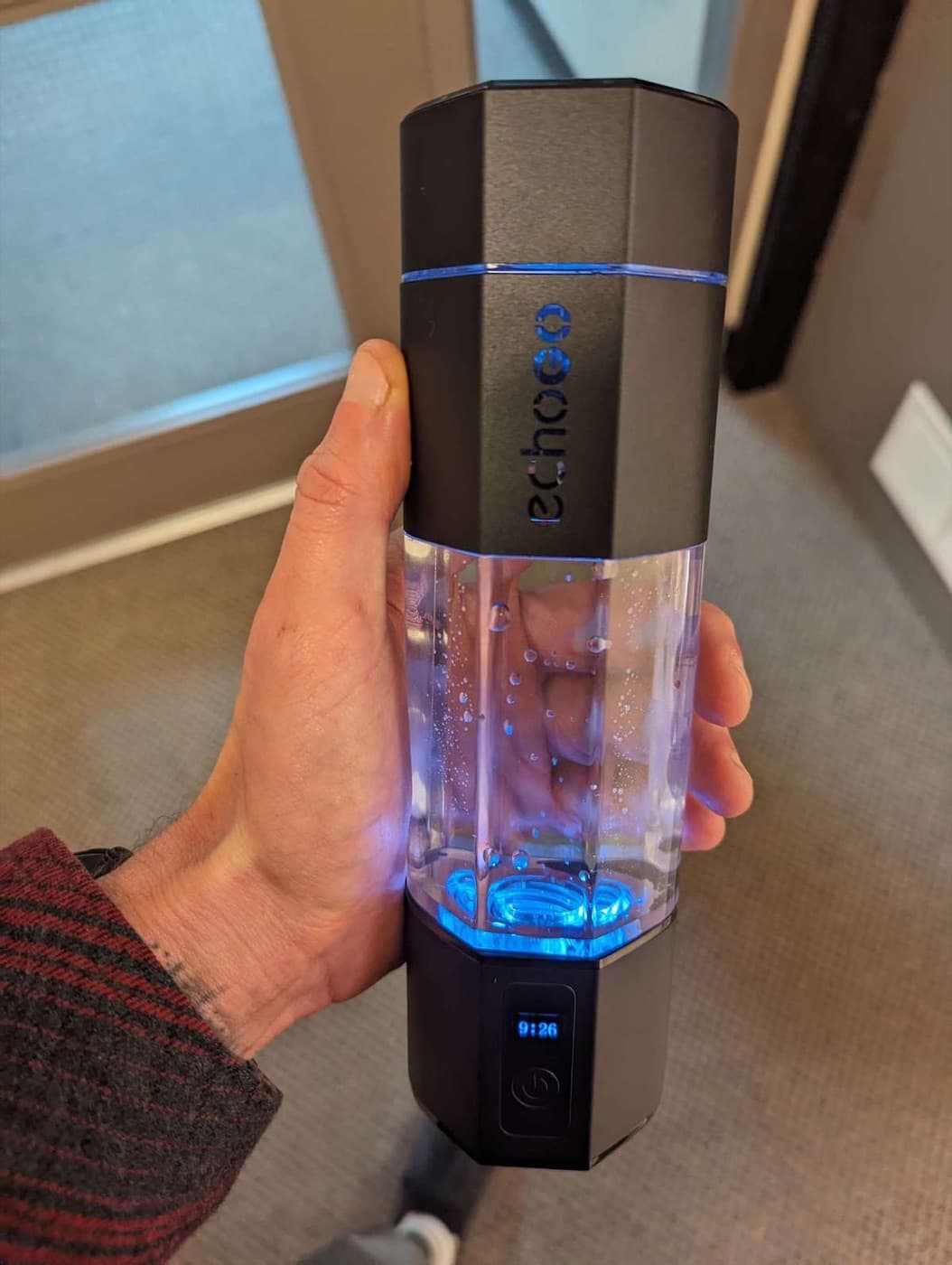 Holding the Echo Flask portable hydrogen water bottle